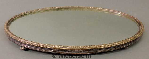 Ladies oval silver rimmed mirrored dressing table: Ladies oval silver rimmed mirrored dressing table tray, late 19th c., with delicate legs, probably French. 1.5"h.x21"l.x14.5"w.