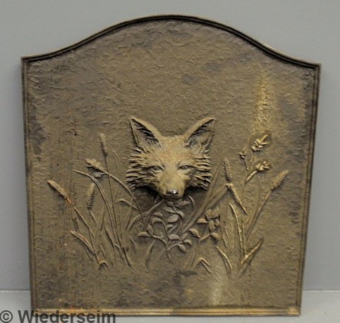 Cast iron fireback, late 20th c., with a fox head : Cast iron fireback, late 20th c., with a fox head mask. 24"h.x21.75"w.x6"d.