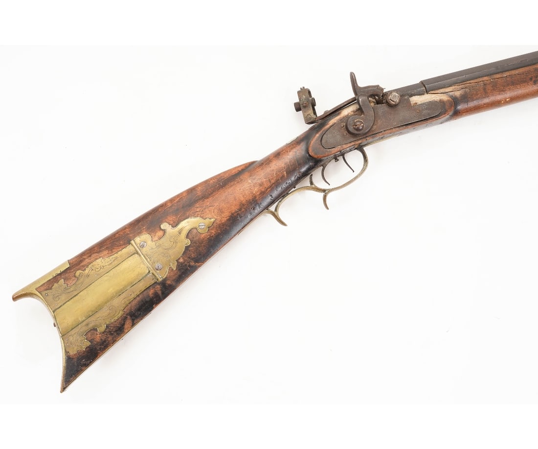 ANTIQUE PERCUSSION RIFLE: Antique percussion long rifle by Leman, Lancaster, Pa, early 19th c., with set trigger and brass patch box. 52.5"l oa / Barrel: 35.5"l