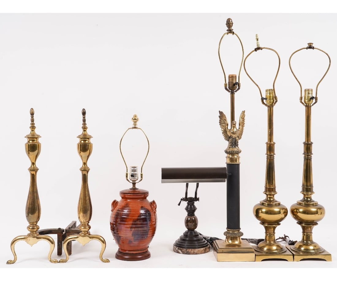 LAMPS AND ANDIRONS: Reproduction redware lamp (7"dia) and a marble office lamp; together with a pair of brass lamps, another lamp and a pair of reproduction brass andirons. Tallest brass lamps: 33" to top of of harp