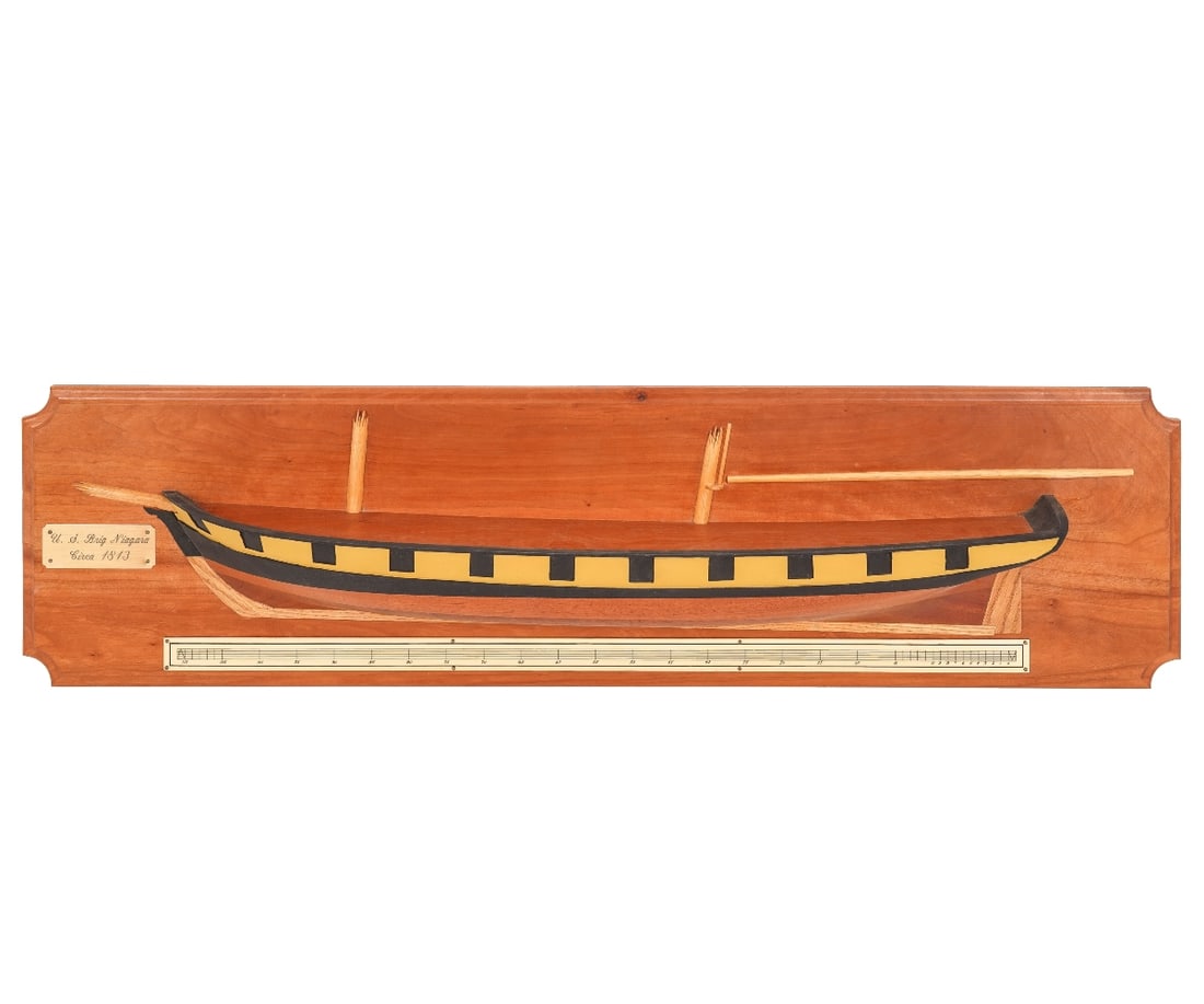 HALF HULL MODEL: Half hull model of the U.S. Brig "Niagara', mounted on a cherry wood backing. Provenance: Approved for deaccession from the Independence Seaport Museum, Philadelphia, PA with proceeds to benefit the A