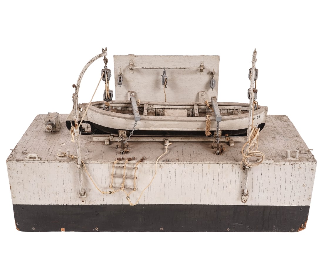SHIP MODEL LIFE BOAT: U.S. Navy type model of a working life boat with metal davits mounted on a plywood base, circa 1950's. 19"h x 30"l x 12"w