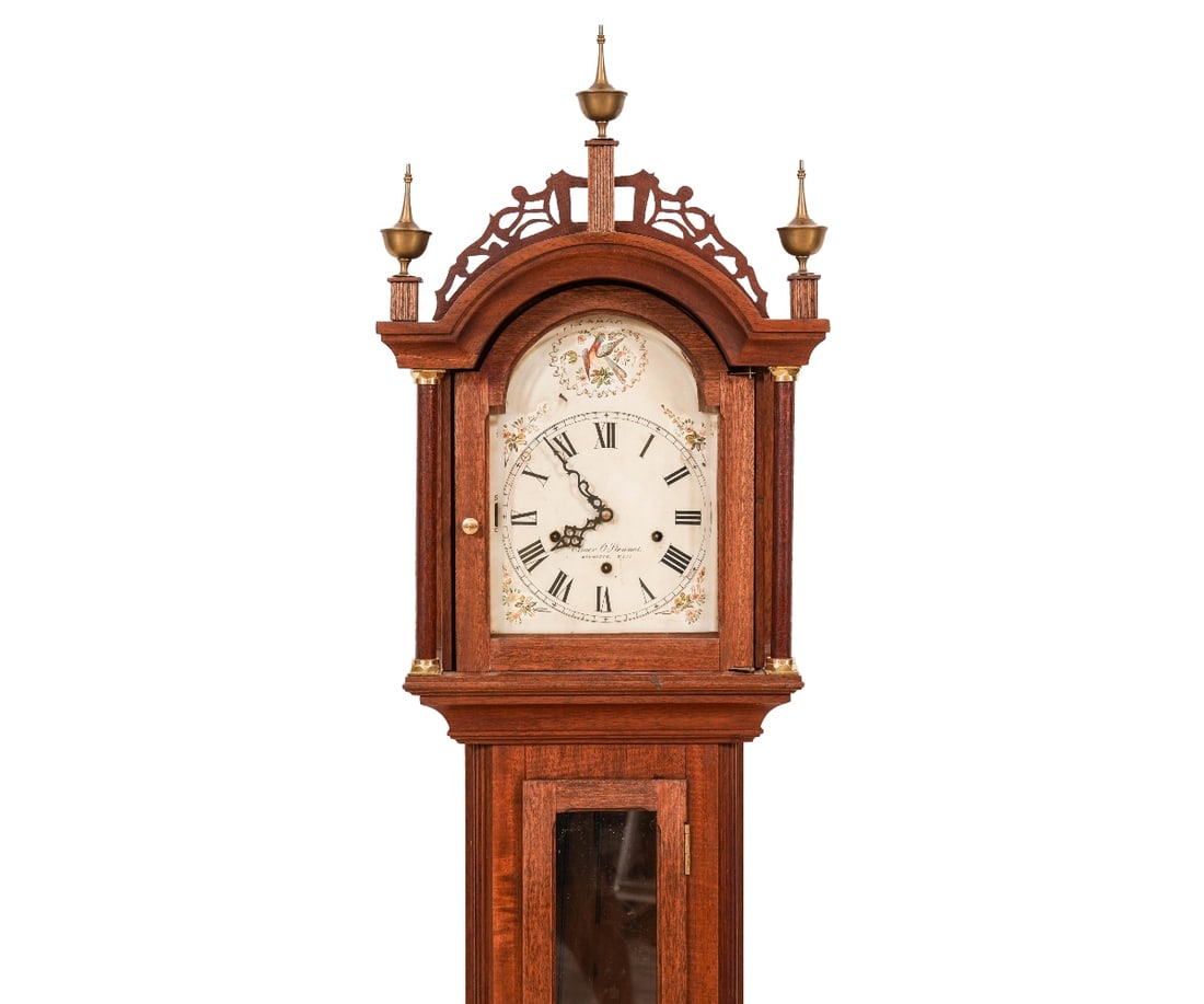 ELMER O. STENNES GRANDMOTHER CLOCK: Elmer O. Stennes, Weymouth, Mass., dwarf grandmother clock with 8-day time, strike and chime movement in a Roxbury mahogany inlaid case. 61"h x 13.25"w x 8.5"d