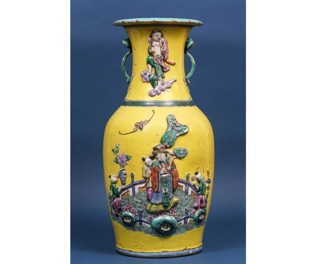 CHINESE PORCELAIN YELLOW VASE: Chinese porcelain yellow vase decorated with relief figures and bats, 18th c. 18.25"h x 8.5"dia