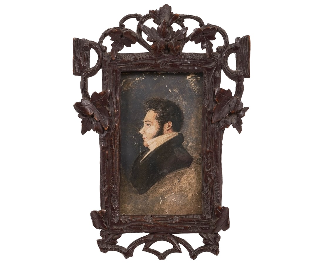 MINIATURE PORTRAIT: Miniature portrait of a young gentleman, 19th c., mounted in a carved Black Forest frame. 7" x 4.75" oa