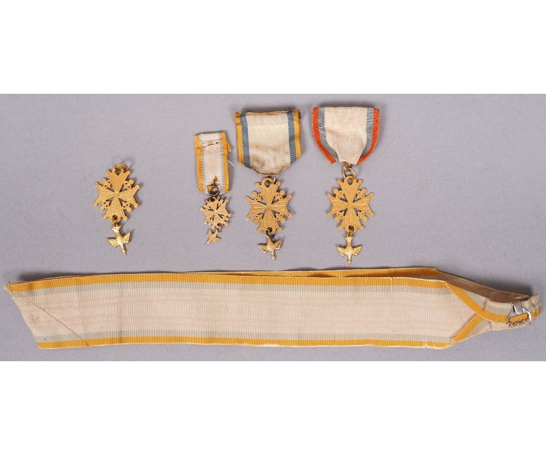 FOUR HUGUENOT SOCIETY MEDALS: Four early National Huguenot Society medals, probably gold filled. Largest: 2" x 1"