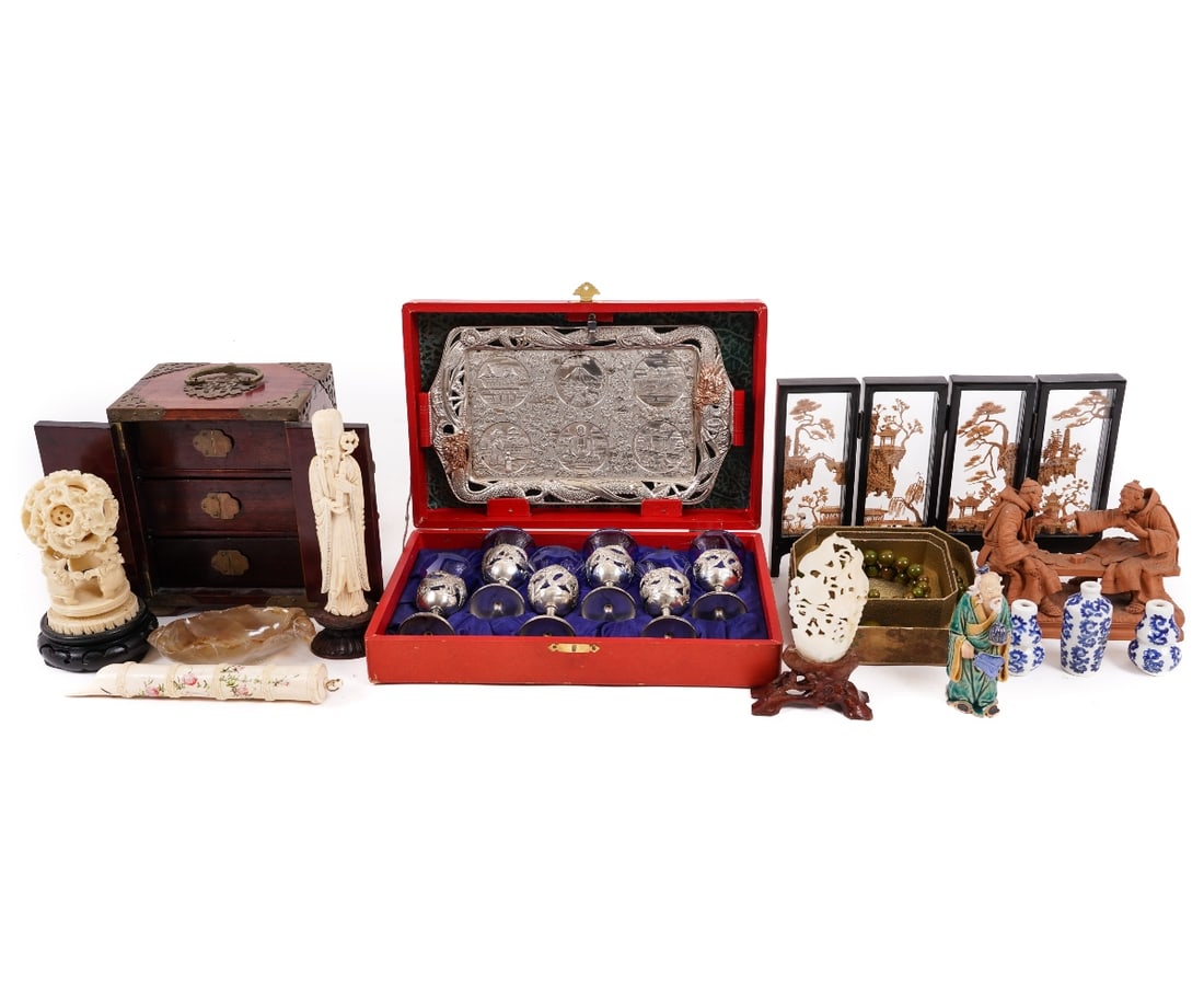 ASIAN SILVER PLATED DRAGON TRAY etc.: Red cased Asian silver plated dragon tray 10"l x 7.5"w and six cups with cobalt glass inserts; an Asian wood and stone jewelry box; carved bone puzzle ball; calligraphy holder etc.