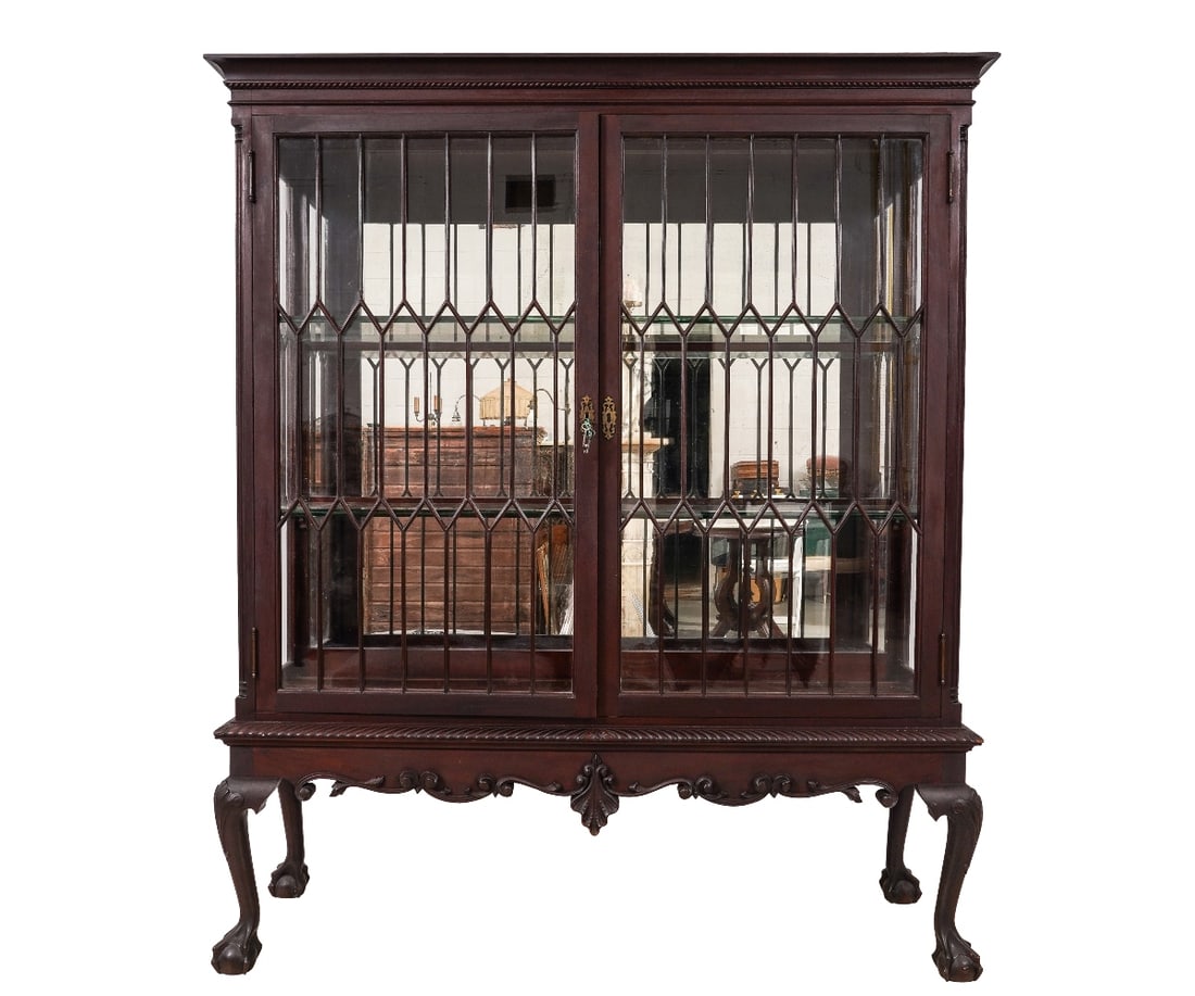 CHIPPENDALE STYLE CRYSTAL CASE: Philadelphia Chippendale style dining room crystal case with mirrored back and ball and claw feet, circa 1880, made for glassware. 67"h x 56.5"w x 16"d