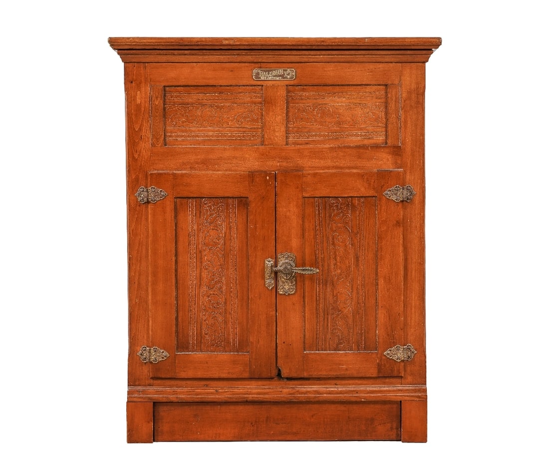 UPRIGHT MAPLE ICE CHEST: Upright maple ice chest labeled The Baldwin, Burlington, VT with galvanized metal interior. 46"h x 36.5"w x 22"d