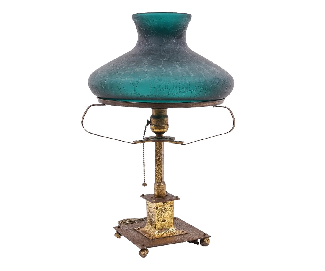 HAMMERED METAL PARLOR LAMP: Arts & Crafts hammered metal parlor lamp with feet shaped like rolling dice, with alligatored green shade, circa 1920. 19"h x 12"dia
