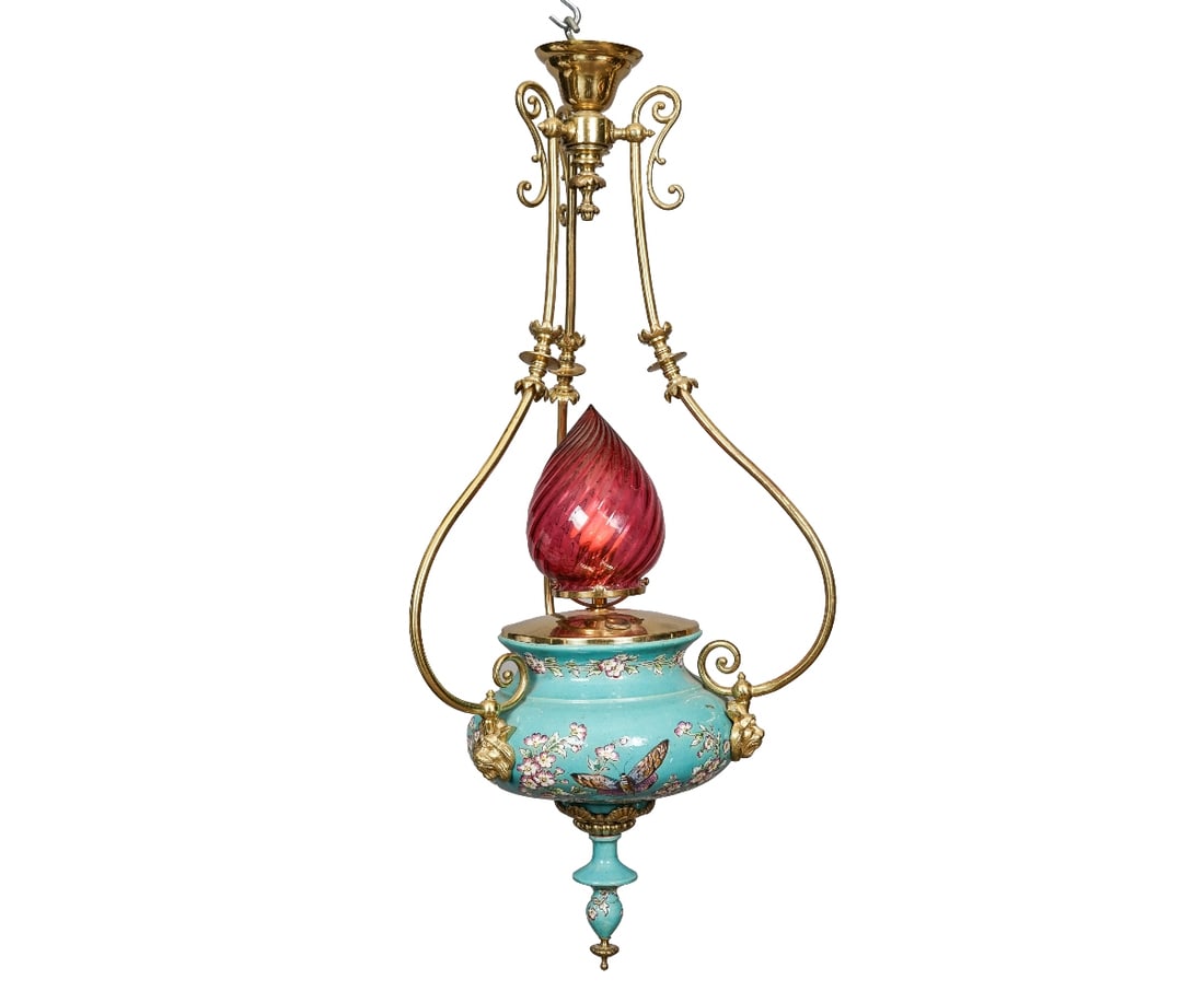 VICTORIAN CRANBERRY GLASS CHANDELIER: Victorian brass, cranberry glass and porcelain chandelier, circa 1880, decorated with flowers and butterflies, converted from gas to electric. 35"h x 15"dia