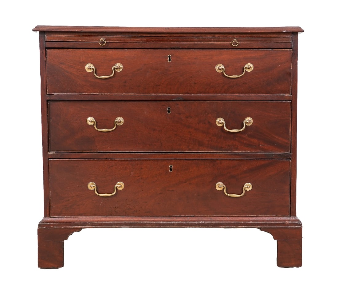 GEORGE III MAHOGANY CHEST: George III mahogany bachelors chest of drawers, circa 1780, having a molded edge one board top above a pull out slide over three drawers and bracket feet. 34"h x 37.25"w x 21"d