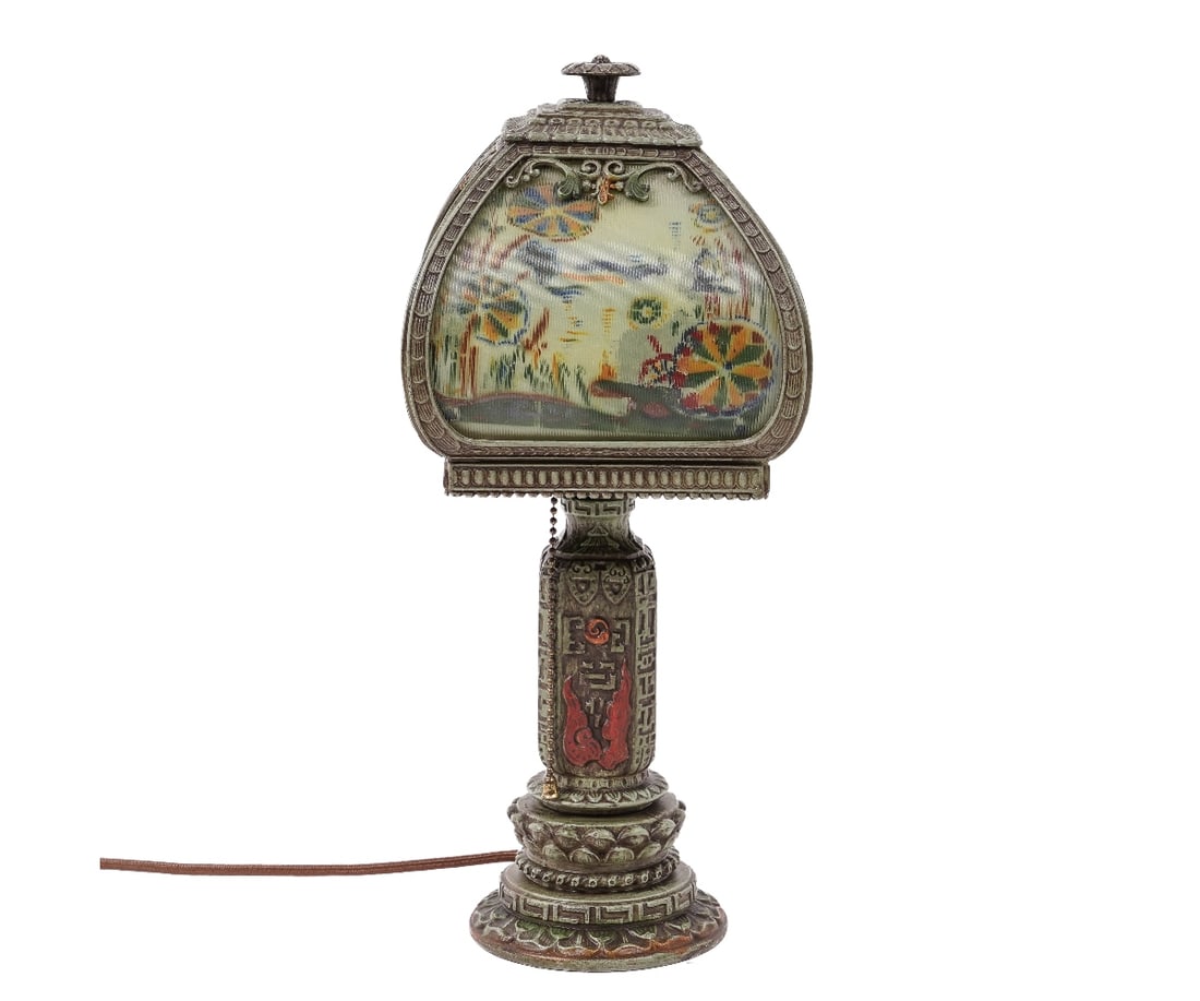 H.E. RAINAUD BOUDOIR LAMP: Painted green metal 'Orientalist' boudoir lamp with a decorated green ribbed glass shade signed "H.E. Rainaud" on shade. 15.5"h x 7"w x 7"d