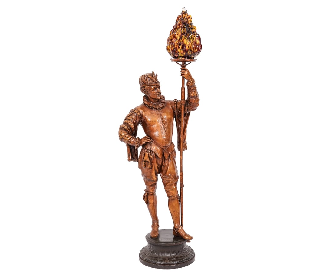 CAVALIER NEWEL POST LAMP: Spelter metal cavalier newel post lamp with colorful torch form shade, circa 1920. 37"h x 13"w x 9"d