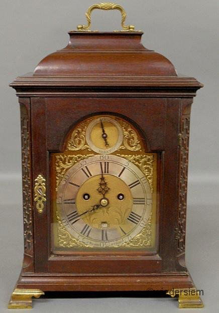 English Chippendale mahogany cased bracket clock, 1: English Chippendale mahogany cased bracket clock, 19th c., the face signed “J. Walker, N. Castle” and with Roman numerals in a pewter chapter ring and with a Fusee movement. 21”h.x13.25”w.x9��