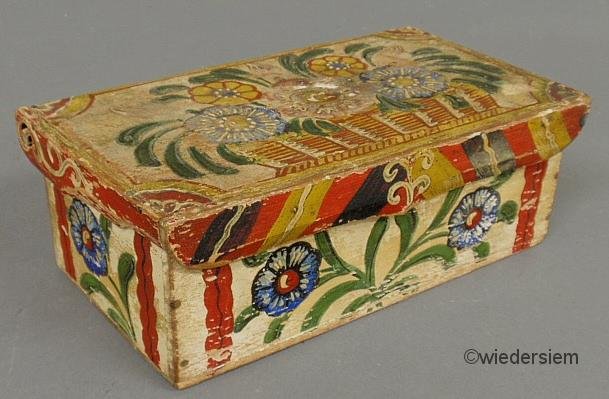 Continental polychrome candle box, 19th c., with c: Continental polychrome candle box, 19th c., with colorful floral decoration. 3.25”h.x9.25”l.