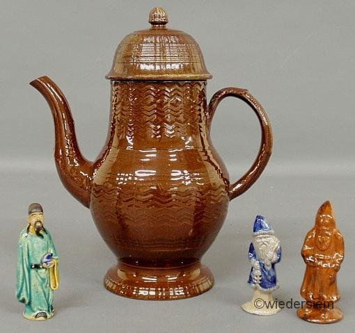 Redware glazed coffeepot 10.5”h. and three small c: Redware glazed coffeepot 10.5”h. and three small ceramic figures.