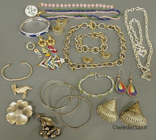 Group of ladies jewelry- 3 sterling silver pins, : Group of ladies jewelry- 3 sterling silver pins, 4 Mexican silver bracelets, sterling silver and peridot link bracelet, 2 silver clad seashells and a group of misc., costume pieces.