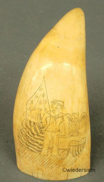 Ivory scrimshaw whale’s tooth, c.1850, decorated w: Ivory scrimshaw whale’s tooth, c.1850, decorated with a sailor, American eagle and shield and the American flag. 5”h.