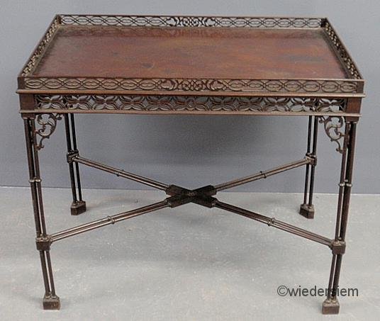 Chinese Chippendale Edwardian mahogany silver tabl: Chinese Chippendale Edwardian mahogany silver table with pierced fretwork, delicate turned legs and stretcher base. 27.5”h., top 32.5”w.x21”d.