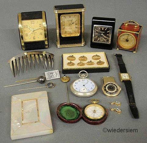 Grouping of travel clocks to include: a small enam: Grouping of travel clocks to include: a small enameled example by “L.S. Mayer, Germany” (no jewels) 2.125”h., a Cartier wristwatch, stick pins, pair of topaz earrings, etc.