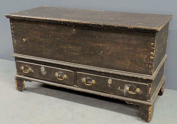 Pennsylvania blanket chest, late 18th c., with brown pa: Pennsylvania blanket chest, late 18th c., with brown paint decoration, lift lid, two drawers and straight bracket feet. 28.5”h.x49.5”w.x21”d.