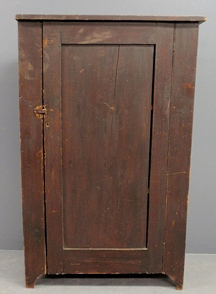 Single door cupboard, c.1830, with brown paint decorati: Single door cupboard, c.1830, with brown paint decoration. 57.5”h.x35”w.x13”d.