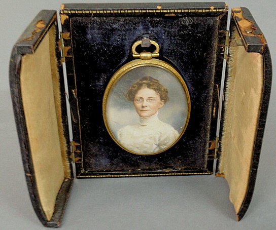 Miniature oval portrait of a woman signed l.r. “Bachrac: Miniature oval portrait of a woman signed l.r. “Bachrach (copy)” and with a folding leather case. 3”x2.25”