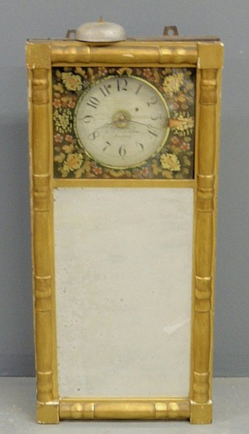 Sheraton wall clock, c.1800, with a wood dial signed “W: Sheraton wall clock, c.1800, with a wood dial signed “Warranted By Wm. Cummens, Roxbury” (Massachusetts), with a mirrored front. As found. 36”h.x16”w.