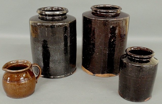 Three Pennsylvania manganese glazed jars, largest 10.5”: Three Pennsylvania manganese glazed jars, largest 10.5”h., and a bean pot.