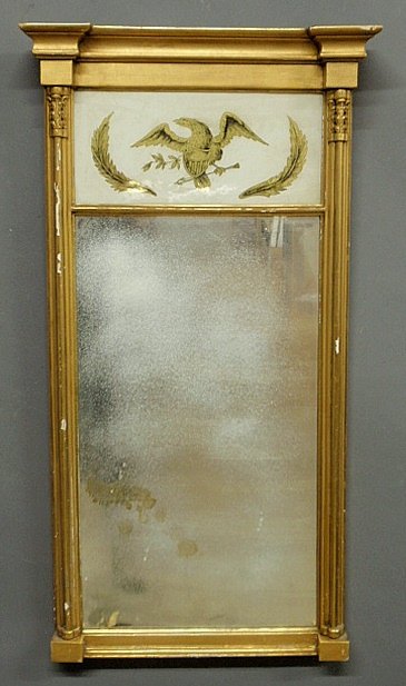 Sheraton gilt mirror with reverse painted églomisé pane: Sheraton gilt mirror with reverse painted églomisé panel of an American eagle. 38”h.x20.5”w.