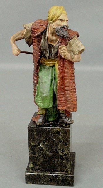 Cold painted bronze of an Arabian man with sword, mount: Cold painted bronze of an Arabian man with sword, mounted on a black marble base. 11”h.x3”w.