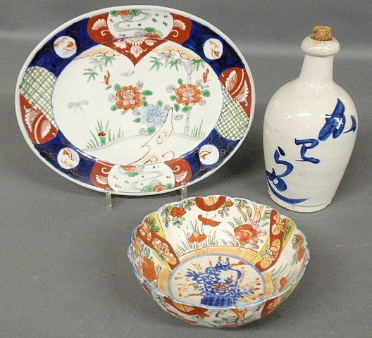 Imari porcelain platter 12”l., Imari bowl 7.25”dia. and: Imari porcelain platter 12”l., Imari bowl 7.25”dia. and a Chinese earthenware bottle with blue decoration 9”h.