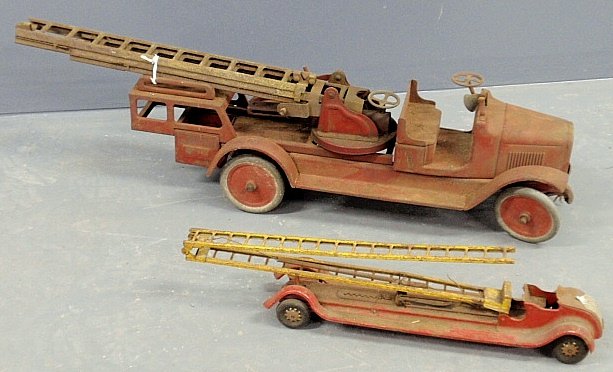 Buddy L red tin toy fire truck 9.5”h.x36”l. and a small: Buddy L red tin toy fire truck 9.5”h.x36”l. and a smaller Kingsbury fire truck.