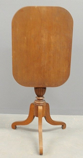 Cherry candlestand, early 19th c., with a rectangular t: Cherry candlestand, early 19th c., with a rectangular top, urn form base and scrolled feet. 28.5”h., top 23.5”x17.5”