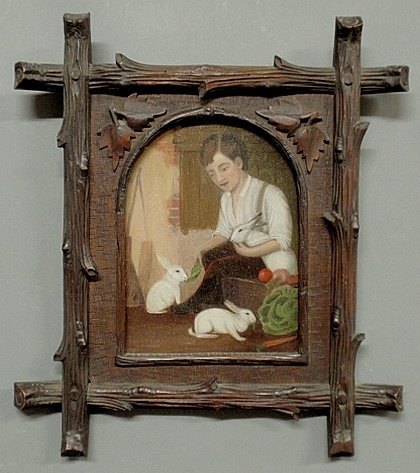 Oil on board painting of a seated boy feeding three: Oil on board painting of a seated boy feeding three white rabbits, late 19th c., and mounted in a Black Forest carved frame. Provenance: Dixon-Hall Fine Art. 9.25”x6.75”