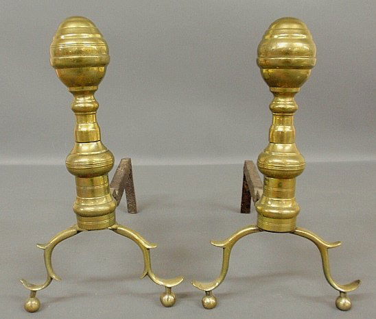 Pair of brass andirons, c.1790, with spurred legs and: Pair of brass andirons, c.1790, with spurred legs and ball feet. 12.5”h.x7.5”w.x14”d.