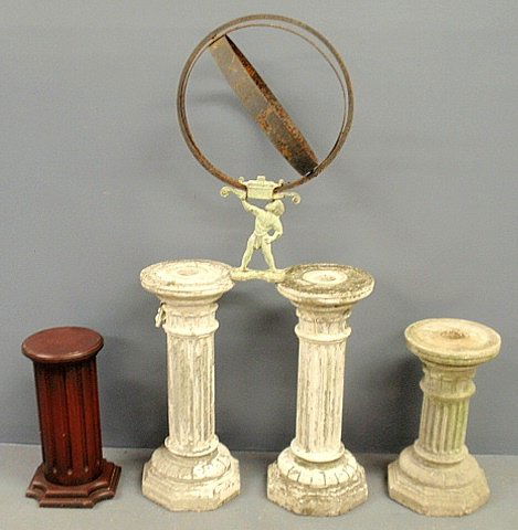 Three cast stone pedestals, one wood pedestal and an: Three cast stone pedestals, one wood pedestal and an Atlas sundial.
