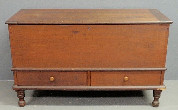 Poplar blanket chest, c.1850, with red paint: Poplar blanket chest, c.1850, with red paint decoration, lift lid, two lower drawers, ring turned legs and ball feet. 27”h.x 45”w.x19.5”d.
