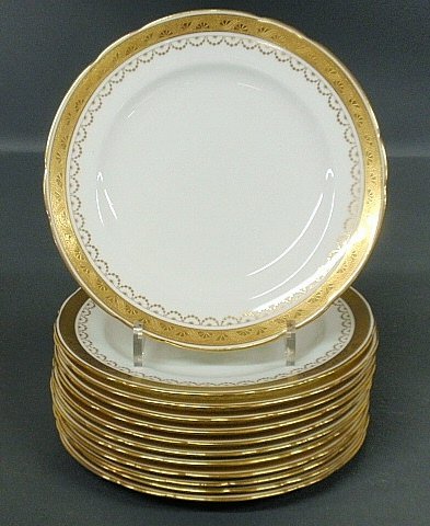 Set of twelve Minton dinner plates with gilt decorated: Set of twelve Minton dinner plates with gilt decorated borders. 9.25"dia.