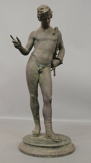 Bronze verdigris statue of Bacchus wearing a goat hide: Bronze verdigris statue of Bacchus wearing a goat hide and mounted on a circular base, unsigned. 24.5"h., base 9"dia.