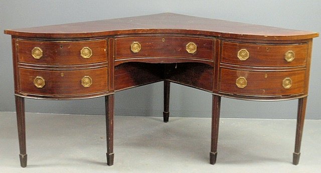 Unusual Georgian corner inlaid mahogany sideboard with: Unusual Georgian corner inlaid mahogany sideboard with a faux center drawer and bottle drawer. 38"h.x38"w.x36.5"d.