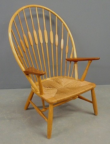 Hans Wegner peacock armchair, Danish 20th c., the ash: Hans Wegner peacock armchair, Danish 20th c., the ash frame with teak armrests and branded underneath "Johannes Hensen, Copenhagen, Denmark". 42"h.x27.25"w.x20"d., seat 14"h.