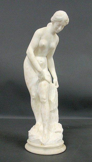 Carved alabaster nude statue of a young woman, and: Carved alabaster nude statue of a young woman, and mounted on a circular base. 23.5"h.x7"w.
