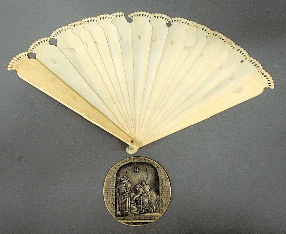 Early sepia on ivory medallion dungeon scene signed: Early sepia on ivory medallion dungeon scene signed indistinctly and with "No. 26" verso, 3.25"x3", together with a 19th c. ivory/bone fan 8.5"h.