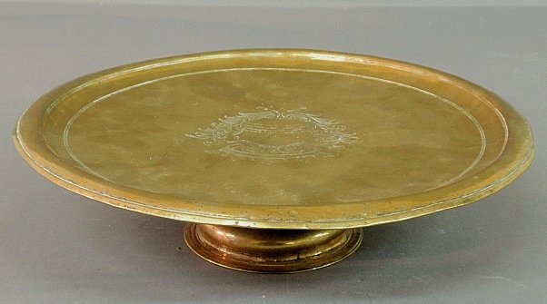 Early Dutch brass tazza, c.1700, the center engraved wi: Early Dutch brass tazza, c.1700, the center engraved with an armorial crest. 3.25"h.x13"dia.