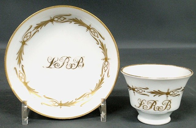 Tucker porcelain handleless cup & saucer, c.1830, with: Tucker porcelain handleless cup & saucer, c.1830, with monogram "L.R.B.". 3"h., saucer 5.75"dia.