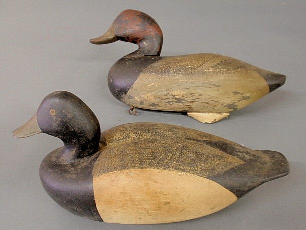 Carved bluebill decoy signed :Chet Reneson” (Connecticu: Carved bluebill decoy signed :Chet Reneson" (Connecticut) and a redhead decoy signed "H.W.J., Chestertown, 1964", both with original paint decoration and each approx. 7"h.x14"l.x6"w.