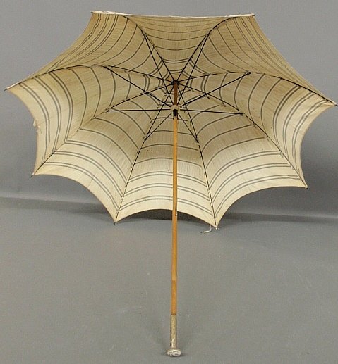 Rare Wiener-Werkstatte parasol with a hammered metal an: Rare Wiener-Werkstatte parasol with a hammered metal and enameled oval handle. 35.5"l., handle 1.25"l.