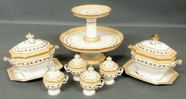 Paris porcelain partial china service, c.1880, to: Paris porcelain partial china service, c.1880, to include: 2 covered sauce tureens 7"h., bases 8"x6.5", 3 covered cups 4.25"h., and a two-tiered dessert dish 9"h.x10.5"dia. All as found.